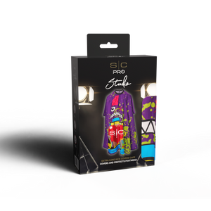A boxed studio cover-up garment package standing upright on a white background. The black retail box shows the brand 's1c PRO Studio' and depicts a colorful protective cover-up with purple, green, red, and blue graphics.