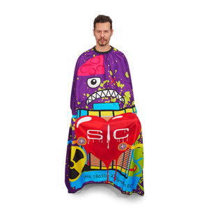 Man wearing a colorful barber cape with cartoon designs on a white background