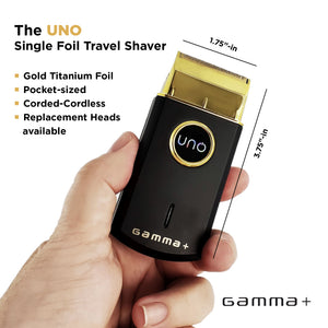 Hand holding a black travel Uno Professional Single Foil Shaver with gold foil, labeled 'UNO' and 'Gamma+', showing dimensions.