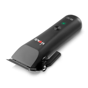 Homie nano hair clipper with a clip-on handle, featuring a green LED indicator light, a silver power button, and a white logo on a clean white background.