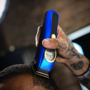 In use shot of Instinct clipper with I N 2 Vector motor with blue lid.