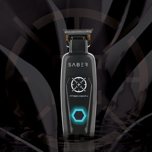 SABER Precision electric hair clipper standing upright against a dark, abstract background with subtle circular patterns.