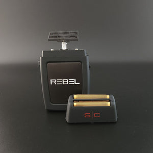 Rebel Professional Double Foil Shaver
with a matching black and gold replacement head, displayed on a dark gray studio background.