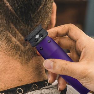 Reign trimmer with EON Digital Brushless Motor viewed in barber hand cutting hair lines