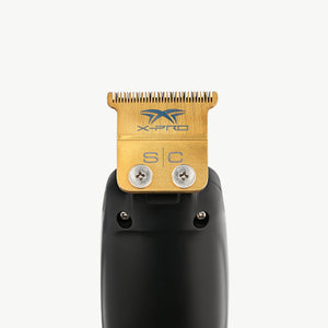 Saber precision black trimmer with gold titanium x pro blade and black design on a white background