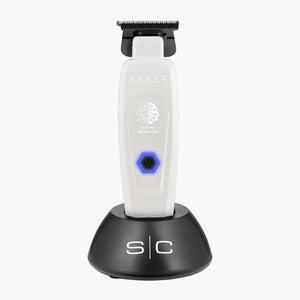 White Saber Trimmer with Digital Brushless Motor in charging base.