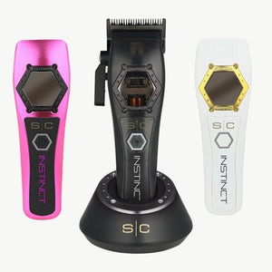 Black Instinct Metal Professional Hair Clipper with I N 2 Vector Motor in charging base, with a pink and black lid, and a white and gold lid featured on each side