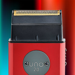 Close-up of the Uno 2.0 Professional Single Foil Shaver with a black top housing and a gold metallic cutting edge, featuring a circular gray badge on the front that reads 'uno 2.0'.