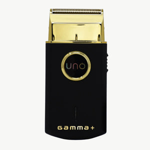 A black and gold UNO Gamma+ electric shaver shown against a plain white background.