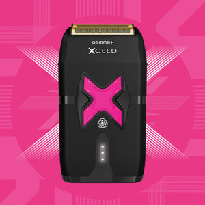 A black Xceed Gamma+ electric shaver with a prominent pink 'X' logo on the front, set against a vibrant pink geometric background.