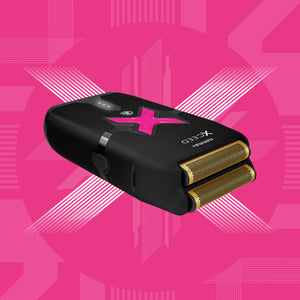 Xceed foil shaver grooming device with a pink logo and gold-toned metal mesh heads, shown floating against a bright pink geometric background.
