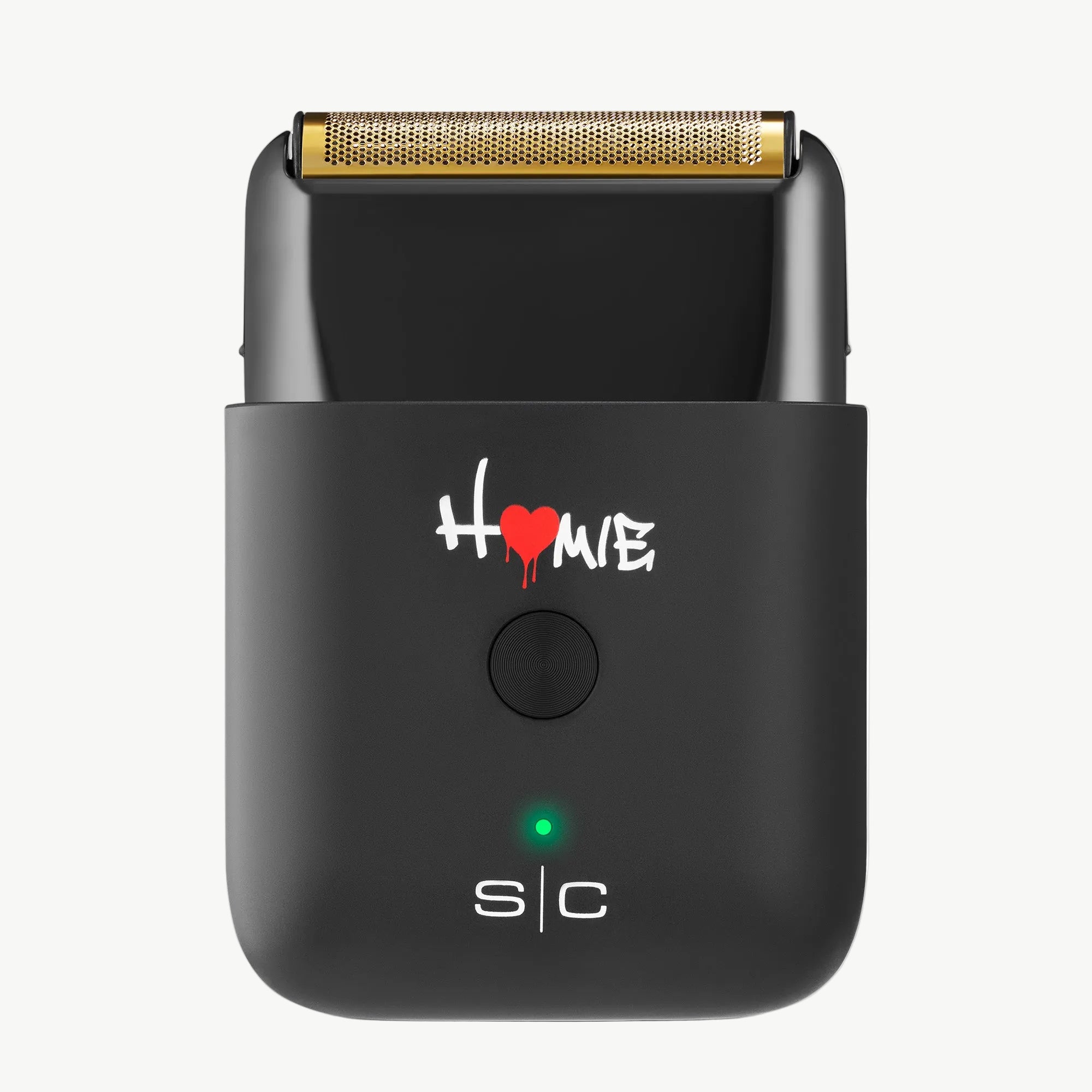 Homie Nano Single Foil Shaver, featuring a gold-colored metallic shaving head, a white and red 'Home' logo, a green LED indicator light, and 's|c' branding on the front, set against a plain white background.