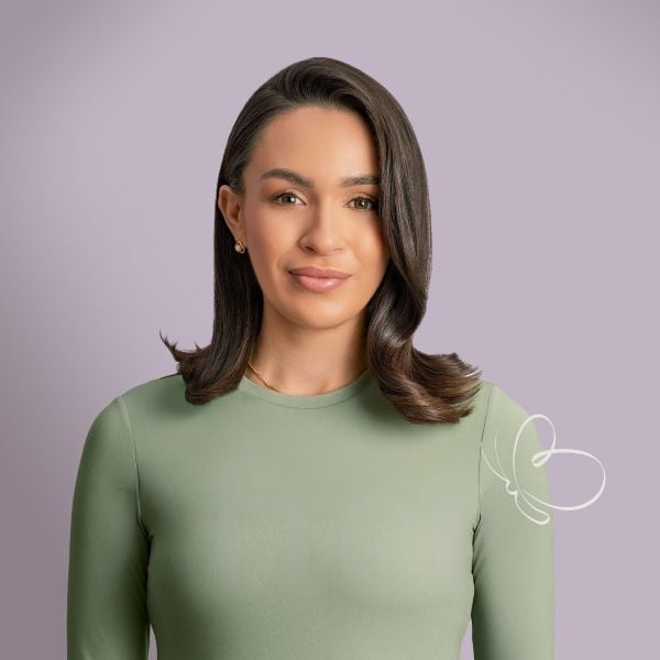 Image of woman with sleek hair on a purple background