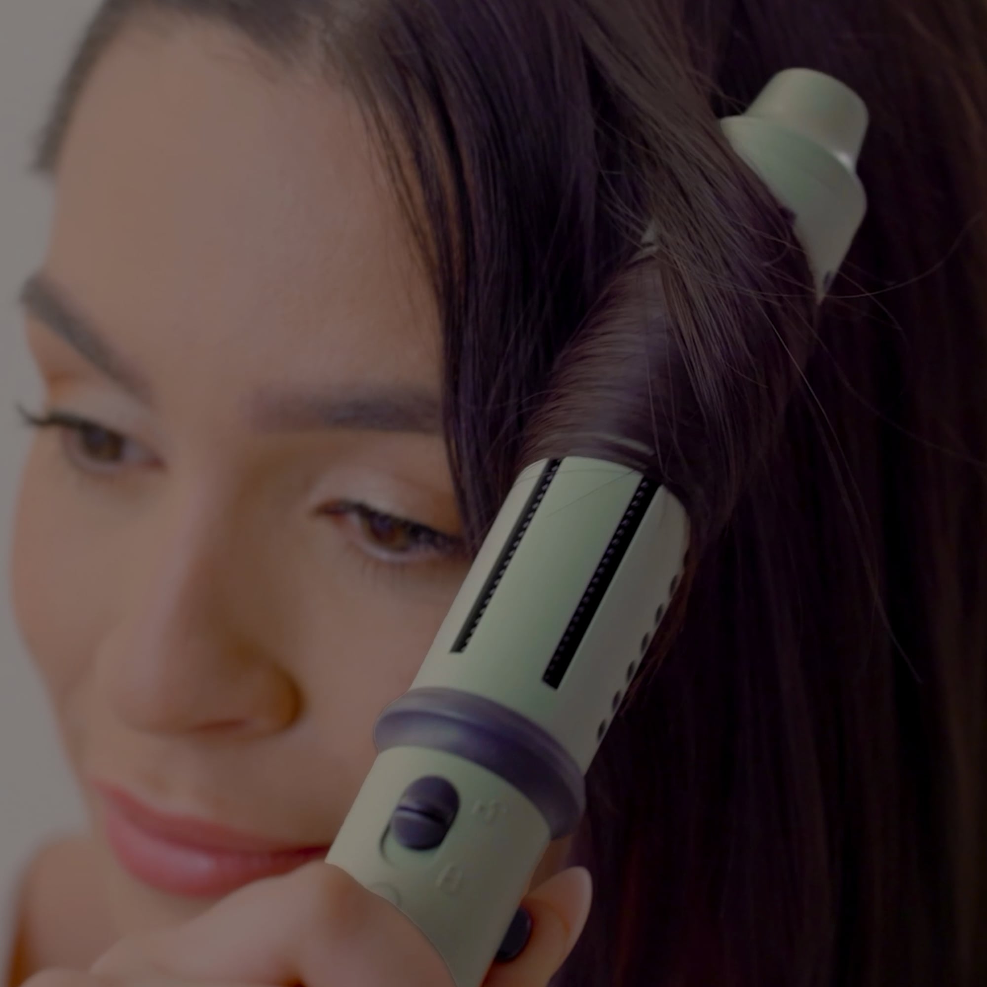 Image of the trimmer in black and gold in charging stands